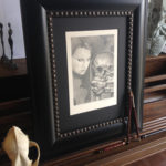 A graphite piece entitled Whisperer. An undead creature taking orders from his muse.