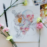 Watercolor painting of skulls and a peony with ink hummingbirds.