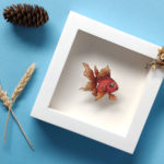 Summer Rain Color Study by Daria Aksenova. Hand-cut illustration of a fish suspended in a shadowbox structure.