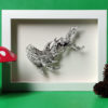 Baby Shark Study by Daria Aksenova. Hand-cut illustration of a baby shark suspended in a shadowbox structure.
