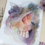Painting is a loose watercolor of the nasal cavity and teeth of a human skull. A loose ink drawing of a cicada is where the eye socket would normally be.