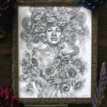 Photo of a drawing of Medusa hugging sunflowers.