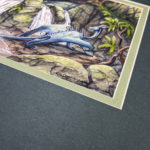 Watercolor painting of blue dragon crossing a small waterfall in the forest. Photo shows close up of the artists signature