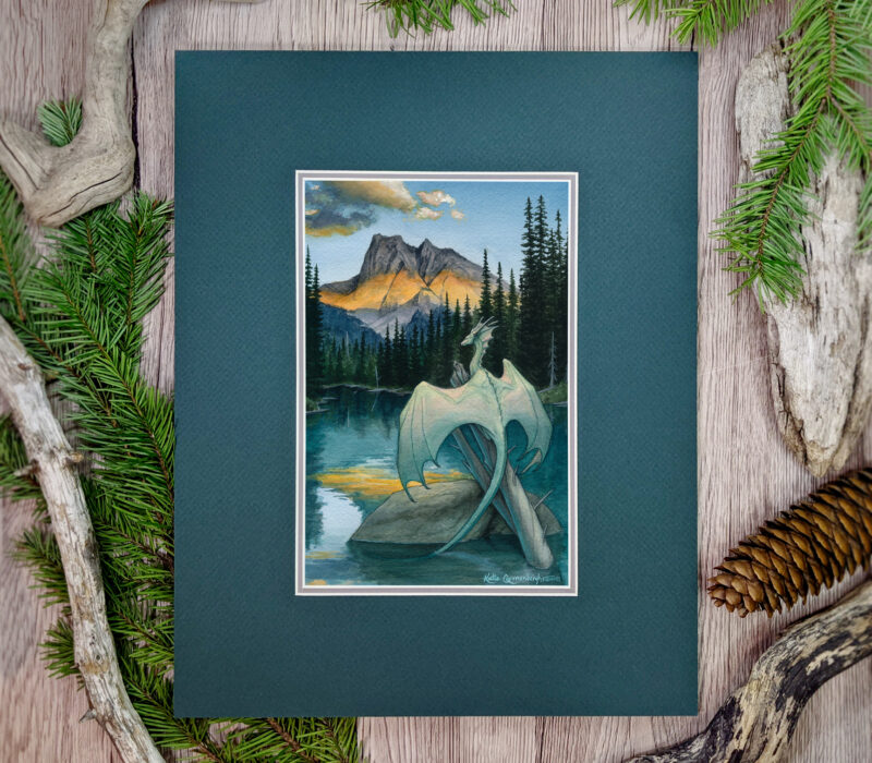 A pale greenish blue dragon perches on a tree in a lake, facing the mountain range as the sun sets across it