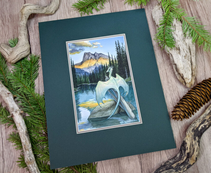 A pale greenish blue dragon perches on a tree in a lake, facing the mountain range as the sun sets across it