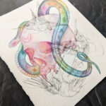 A watercolor painting of a rainbow snake wrapping around a human skull. There are sketchy ink humming birds overlaying the painting.