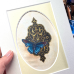 blue monarque painting on a gold background