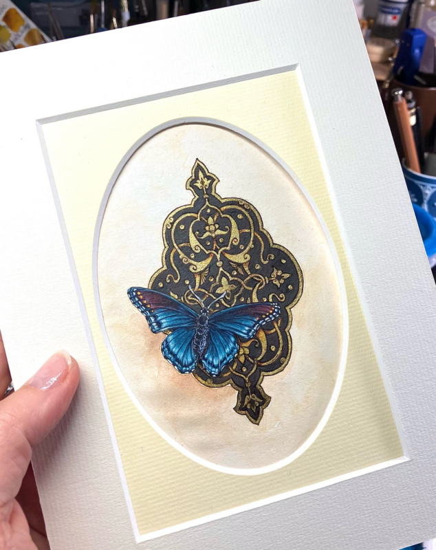 blue monarque painting on a gold background