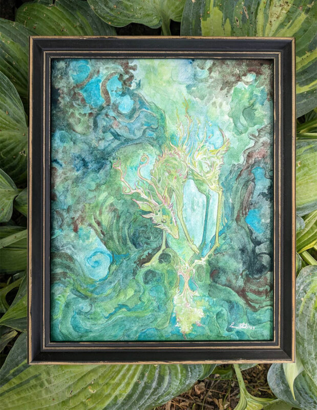 green deer watercolor framed and displayed on hosta leaves.