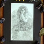 Graphite piece of a gorgon with snakes skeletons as hair.