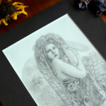 Graphite piece of a gorgon with snakes skeletons as hair.