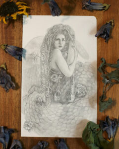 Graphite piece of a gorgon with snakes skeletons as hair.