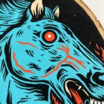 A closeup of the painting highlight the face.