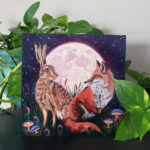 Staged Fox and Hare Painting on Shelf with Plants