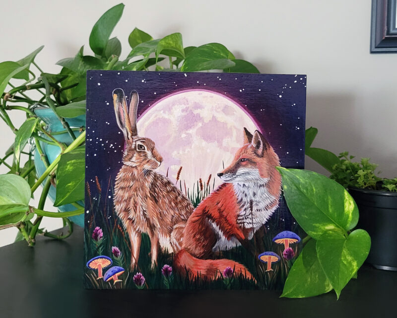 Staged Fox and Hare Painting on Shelf with Plants