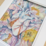 A watercolor painting of a blue heart is tangled within a cluster of blue peonies.