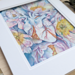 A watercolor painting of a blue heart is tangled within a cluster of blue peonies.