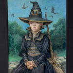 A little girl dressed as a witch sitting on a stone fence