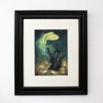 Framed image of a black cat batting at ghost during a seance.