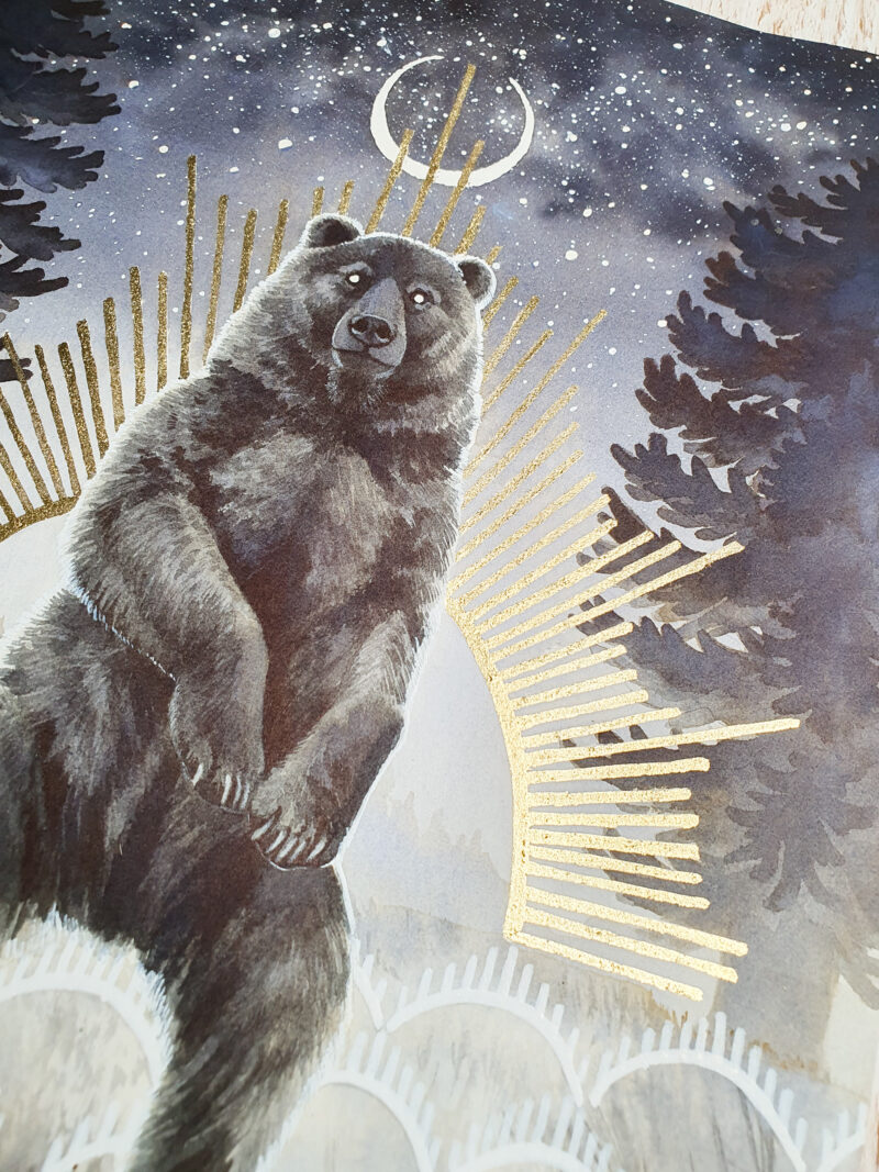 Ink painting of a dark bear standing up, framed by tall grass and fir trees, starry sky with a stylized crescent moon and sun with golden rays.
