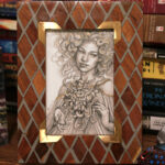 Bloom. Graphite drawing. Photo of the piece framed.