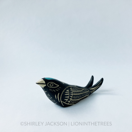 Ceramic black sgraffito Barn Swallow totem. This photo shows the right side of the piece.