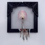 Pink iridescent ribcage holding white heart with gold veins, dripping gold blood