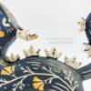 This photo shows a closeup of the various gold overglaze details.