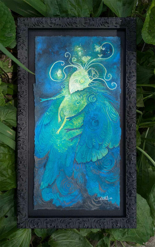 Watercolor painting of a vibrant blue and yellow moth woman, framed in black. She has small moth lights floating around her.