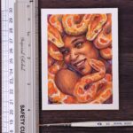 A portrait of a Gorgon smiling. The snakes are orange-color pythons. She has brown skin and has a lovely smile on her face.