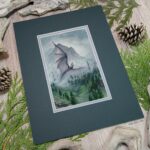 Angled view showing the full artwork with the mat sitting on a table