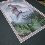 Angled view of the artwork showing a close up of the artist's signature in the corner.