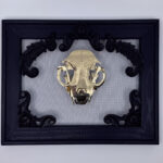 Golden filigree cat skull created with layers of etched and shaped sequin film