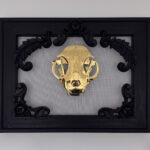 Golden filigree cat skull created with layers of etched and shaped sequin film