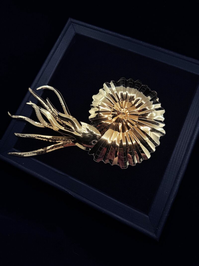 Golden ammonite with elegant tentacles