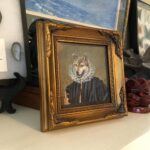 Florentine, framed, amid tchotchkes.