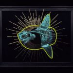 Metallic teal sunfish skeleton in glowing neon yellow outline, a golden sunburst behind