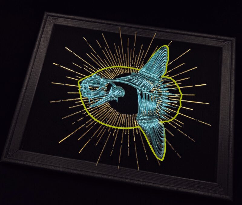 Metallic teal sunfish skeleton in glowing neon yellow outline, a golden sunburst behind