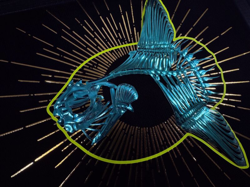 Metallic teal sunfish skeleton in glowing neon yellow outline, a golden sunburst behind