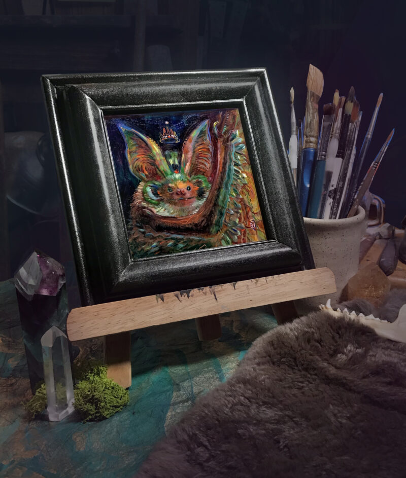 A brightly colored painting of a bat framed for display