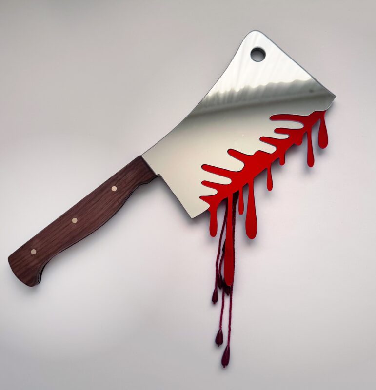 Large silver cleaver with wooden handle, dripping blood