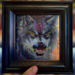 snarling wolf wearing pentagram in a frame
