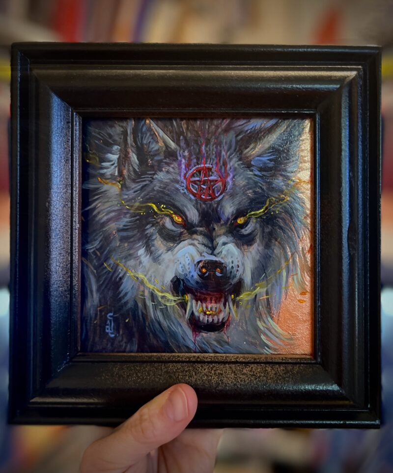 snarling wolf wearing pentagram in a frame