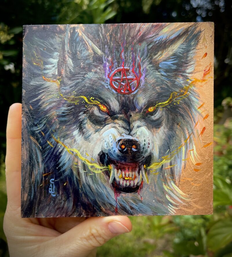 snarling wolf wearing pentagram on copper foil