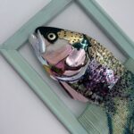 Reverse mermaid - salmon head created with sequin film and shell atop beaded fringe legs