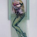 Reverse mermaid - salmon head created with sequin film and shell atop beaded fringe legs