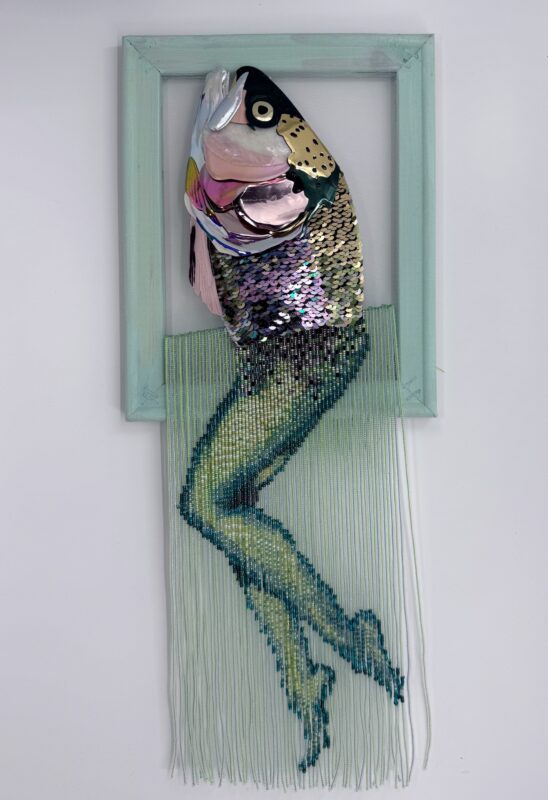 Reverse mermaid - salmon head created with sequin film and shell atop beaded fringe legs