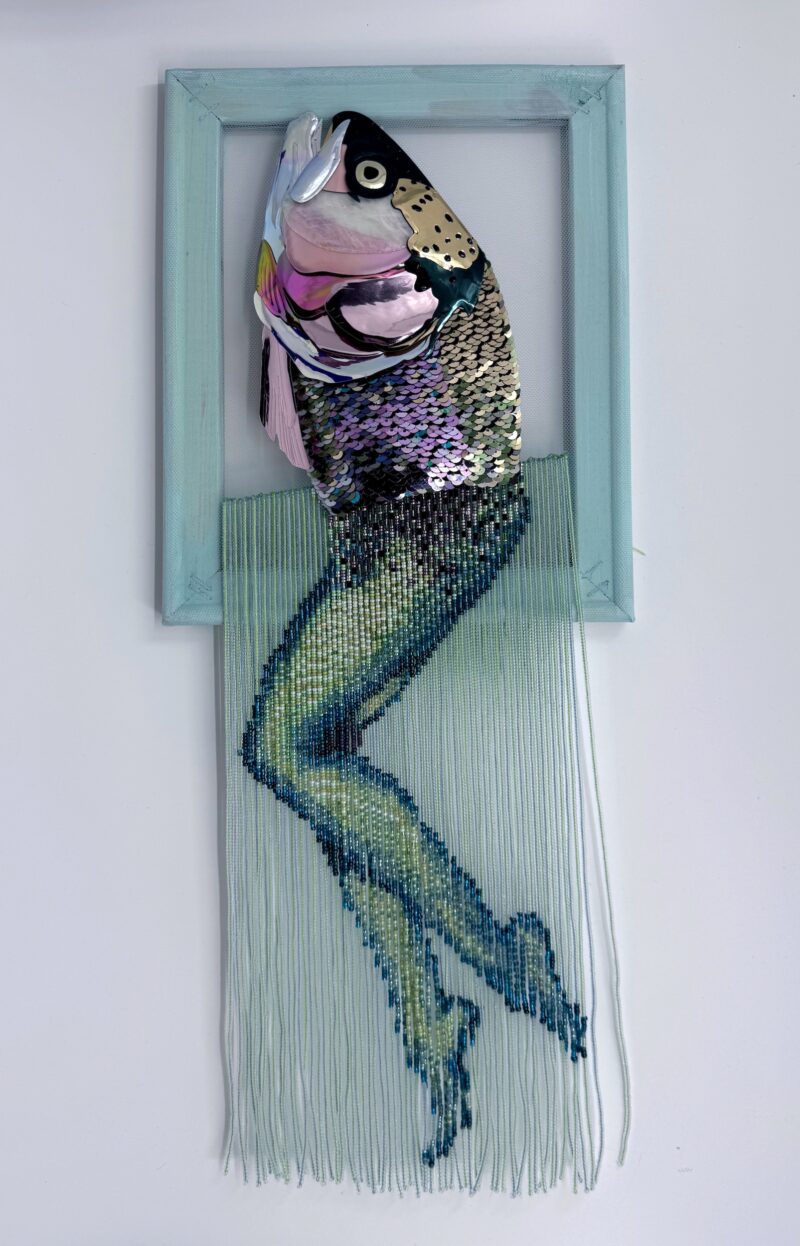 Reverse mermaid - salmon head created with sequin film and shell atop beaded fringe legs