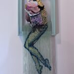 Reverse mermaid - salmon head created with sequin film and shell atop beaded fringe legs