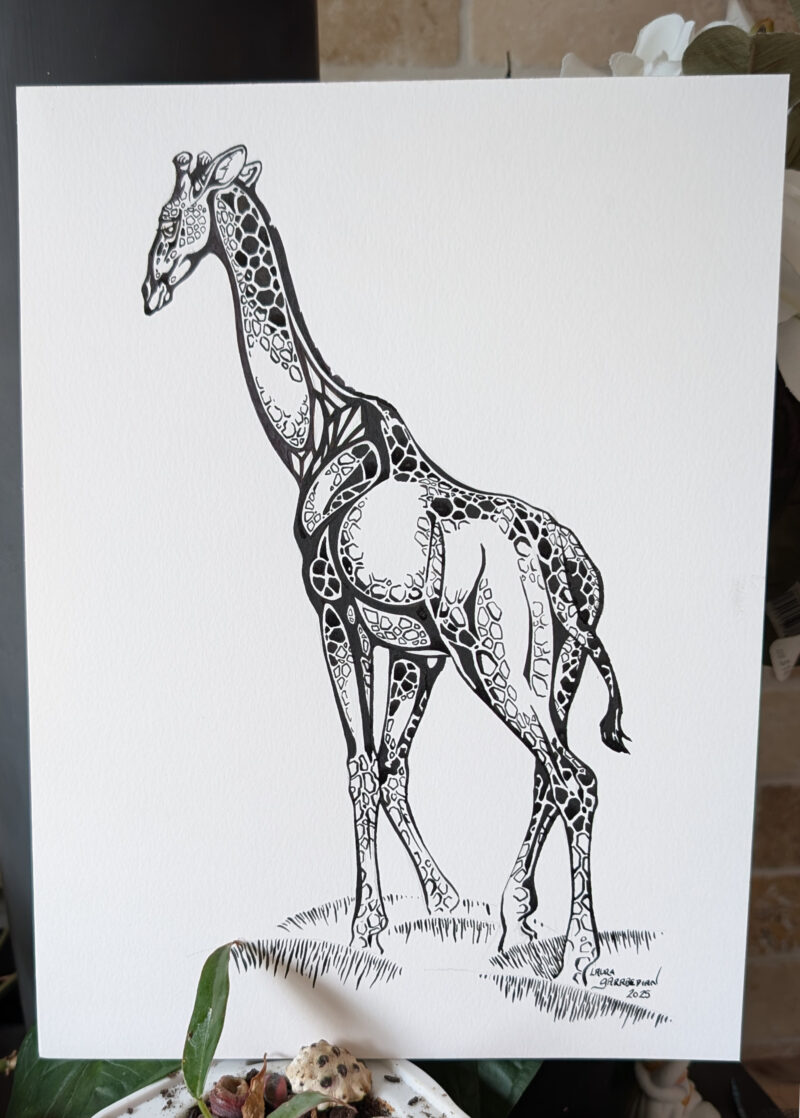 Ink drawing of a giraffe with extremely stylized ink patterning on it's body. The art is laid up upon a wall with a leaf in front